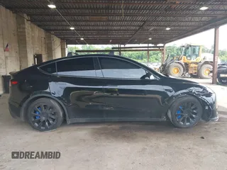 2023 Tesla Model Y Long Range with VIN 7SAYGDEE3PA185778, listed as a IAAI auction lot 39721611 with 11,986 mi miles and . Bid and sale history available at DreamBid. Image 13.