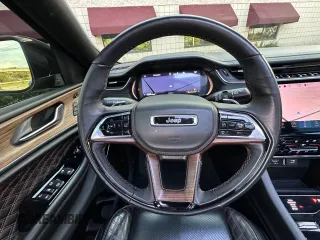 2023 Jeep Grand Cherokee Summit with VIN 1C4RJHEG2P8882566, listed as a Copart auction lot 65095905 with 59,970 mi miles and Salvage title. Bid and sale history available at DreamBid. Image 11.