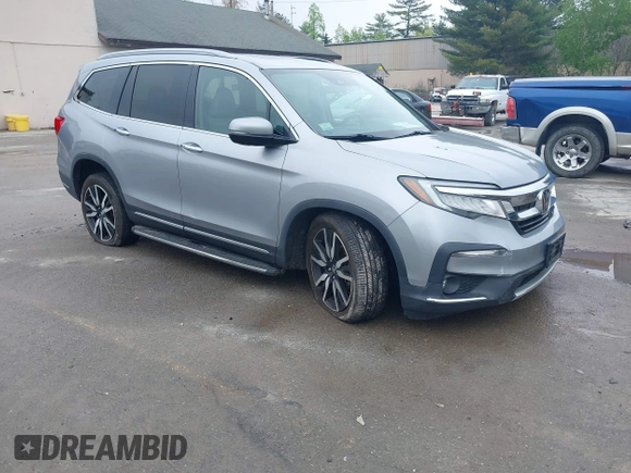 2020 Honda Pilot Touring 8-Passenger z VIN 5FNYF6H91LB042626, wystawiony jako IAAI lot #42249440 z przebiegiem 57 429 mil mil oraz . Historia ofert i sprzedaży dostępna na DreamBid. Obrazek 1.