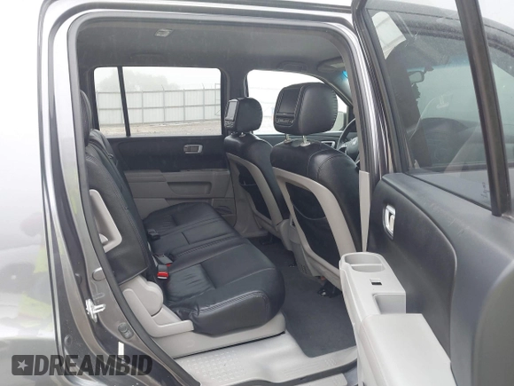 2014 Honda Pilot LX with VIN 5FNYF4H2XEB004614, listed as a IAAI auction lot 42236980 with 160,357 mi miles and . Bid and sale history available at DreamBid. Image 8.