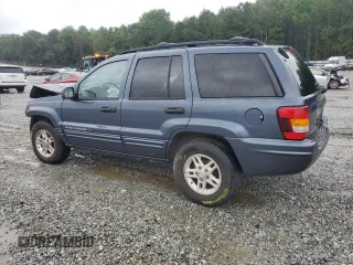 2004 Jeep Grand Cherokee Laredo with VIN 1J4GX48SX4C201569, listed as a Copart auction lot 58631585 with 271,124 mi miles and Salvage title. Bid and sale history available at DreamBid. Image 2.
