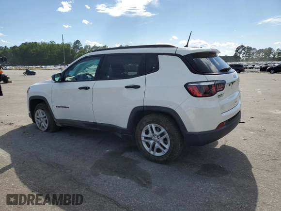 2018 Jeep Compass Sport with VIN 3C4NJCAB7JT140622, listed as a Copart auction lot 58162185 with 128,686 mi miles and Salvage title. Bid and sale history available at DreamBid. Image 2.