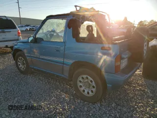 1992 Suzuki Sidekick z VIN 2S3TC01C2N6405497, wystawiony jako Copart lot #75856164 z przebiegiem 38 423 mil mil oraz Szkody całkowita. Historia ofert i sprzedaży dostępna na DreamBid. Obrazek 2.