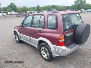 2000 Suzuki Grand Vitara JLX z VIN JS3TD62V7Y4119022, wystawiony jako IAAI lot #42384608 z przebiegiem 153 943 mil mil oraz . Historia ofert i sprzedaży dostępna na DreamBid. Obrazek 3.