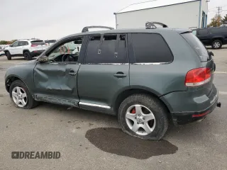 2004 Volkswagen Touareg with VIN WVGCM67L04D027410, listed as a Copart auction lot 79044964 with 100,509 mi miles and Salvage title. Bid and sale history available at DreamBid. Image 2.