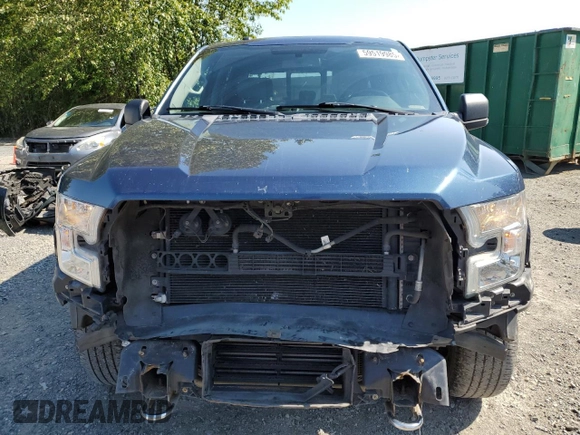 2015 Ford F-150 XLT with VIN 1FTEW1EP7FKE12574, listed as a Copart auction lot 59519985 with 133,337 mi miles and Salvage title. Bid and sale history available at DreamBid. Image 5.