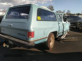 1989 GMC Suburban z VIN 1GKGR26N6KF525569, wystawiony jako IAAI lot #34895460 z przebiegiem Nie podano mil oraz . Historia ofert i sprzedaży dostępna na DreamBid. Obrazek 4.