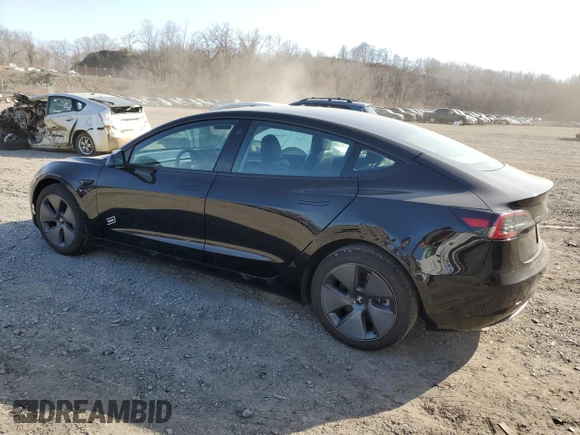 2023 Tesla Model 3 with VIN 5YJ3E1EA3PF670787, listed as a Copart auction lot 49070865 with 13,489 mi miles and Salvage title. Bid and sale history available at DreamBid. Image 2.