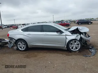 2014 Chevrolet Impala LT with VIN 2G1125S38E9102607, listed as a IAAI auction lot 41860235 with 128,599 mi miles and . Bid and sale history available at DreamBid. Image 14.