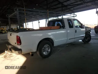 1999 Ford F-250 XL with VIN 1FTNX20FXXEE59499, listed as a Copart auction lot 87511735 with 215,520 mi miles and Salvage title. Bid and sale history available at DreamBid. Image 3.