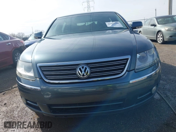 2006 Volkswagen Phaeton z VIN WVWAF03D168000214, wystawiony jako IAAI lot #41935384 z przebiegiem 80 641 mil mil oraz . Historia ofert i sprzedaży dostępna na DreamBid. Obrazek 12.