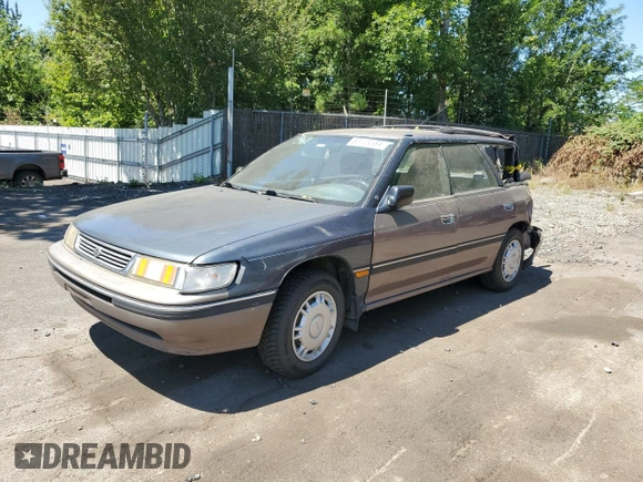 1993 Subaru Legacy L with VIN 4S3BJ6339P6948161, listed as a Copart auction lot 63123584 with 329,619 mi miles and Salvage Title. Bid and sale history available at DreamBid. Image 1.