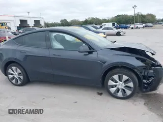 2024 Tesla Model Y with VIN 7SAYGDED3RF002246, listed as a IAAI auction lot 41566184 with 10,316 mi miles and . Bid and sale history available at DreamBid. Image 12.
