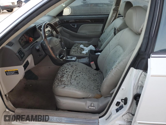 2003 Hyundai XG z VIN KMHFU45E63A237404, wystawiony jako Copart lot #77546824 z przebiegiem Nie podano mil oraz Nie do naprawy. Historia ofert i sprzedaży dostępna na DreamBid. Obrazek 7.