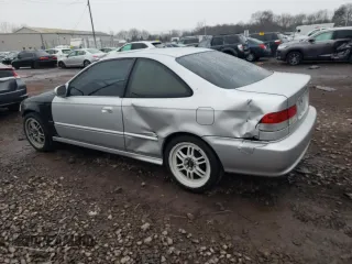 1999 Honda Civic EX with VIN 1HGEJ8140XL066559, listed as a Copart auction lot 82600804 with 323,648 mi miles and Salvage Title. Bid and sale history available at carsss.com. Image 2.