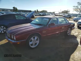 1999 Jaguar XJ with VIN SAJPX1849XC857869, listed as a Copart auction lot 83773914 with 172,496 mi miles and Clean title. Bid and sale history available at DreamBid. Image 1.