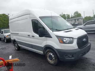 2021 Ford Transit Cargo with VIN 1FTBW1X84MKA98047, listed as a IAAI auction lot 42313747 with 65,600 mi miles and . Bid and sale history available at DreamBid. Image 1.