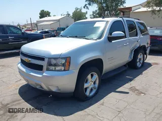 2012 Chevrolet Tahoe LT z VIN 1GNSCBE06CR255554, wystawiony jako IAAI lot #42544690 z przebiegiem 136 070 mil mil oraz . Historia ofert i sprzedaży dostępna na DreamBid. Obrazek 2.