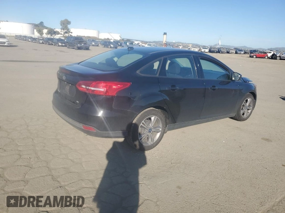 2018 Ford Focus SE with VIN 1FADP3F21JL288026, listed as a Copart auction lot 46908205 with 70,739 mi miles and Salvage Title. Bid and sale history available at carsss.com. Image 3.