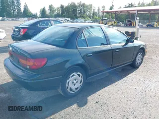 2000 Saturn SL z VIN 1G8ZK5271YZ165467, wystawiony jako IAAI lot #42367156 z przebiegiem 185 962 mil mil oraz . Historia ofert i sprzedaży dostępna na DreamBid. Obrazek 4.