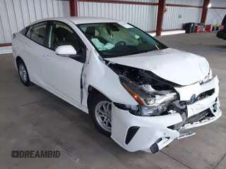 2021 Toyota Prius L Eco z VIN JTDKAMFU5M3146342, wystawiony jako IAAI lot #42249219 z przebiegiem 49 810 mil mil oraz . Historia ofert i sprzedaży dostępna na DreamBid. Obrazek 1.