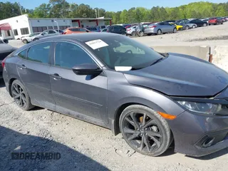 2019 Honda Civic Sport with VIN 2HGFC2F8XKH598141, listed as a IAAI auction lot 42013724 with 98,401 mi miles and . Bid and sale history available at DreamBid. Image 13.