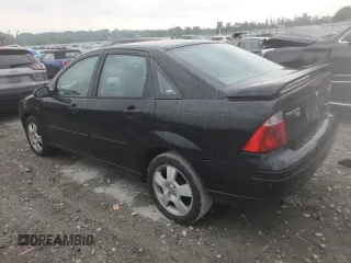 2005 Ford Focus S with VIN 1FAFP34N45W285454, listed as a Copart auction lot 59043485 with 165,071 mi miles and Salvage title. Bid and sale history available at DreamBid. Image 2.