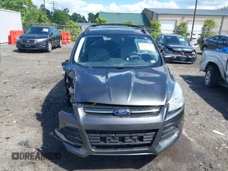 2016 Ford Escape SE z VIN 1FMCU9GX8GUA79697, wystawiony jako IAAI lot #42199779 z przebiegiem 131 826 mil mil oraz . Historia ofert i sprzedaży dostępna na DreamBid. Obrazek 13.