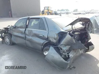 2004 Cadillac DeVille DHS z VIN 1G6KE57Y74U119605, wystawiony jako IAAI lot #40555057 z przebiegiem Nie podano mil oraz . Historia ofert i sprzedaży dostępna na DreamBid. Obrazek 3.