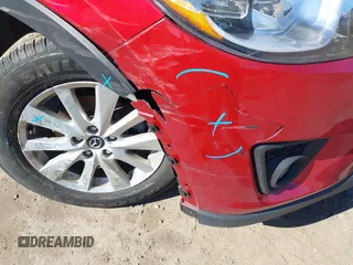 2014 Mazda CX-5 Touring with VIN JM3KE2CY2E0374440, listed as a IAAI auction lot 41634144 with 106,145 mi miles and . Bid and sale history available at DreamBid. Image 12.