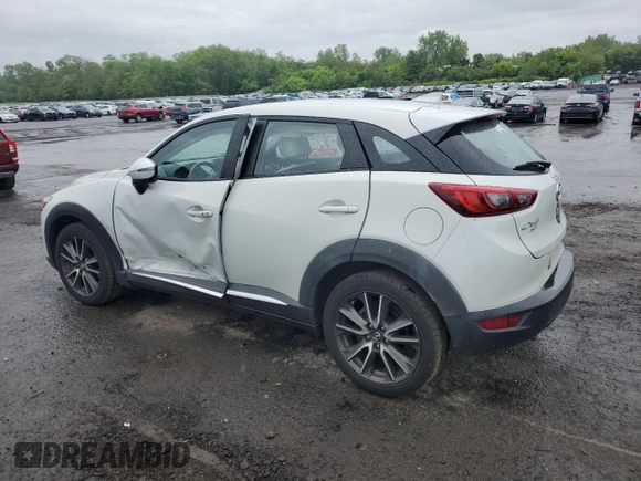 2016 Mazda CX-3 Grand Touring z VIN JM1DKBD77G0105451, wystawiony jako Copart lot #58341495 z przebiegiem 109 525 mil mil oraz Szkody całkowita. Historia ofert i sprzedaży dostępna na DreamBid. Obrazek 2.