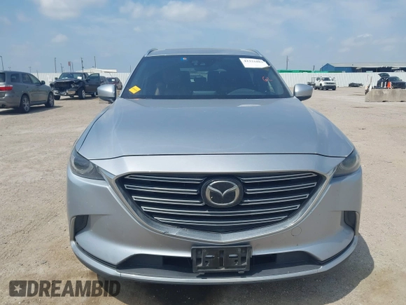 2016 Mazda CX-9 Signature with VIN JM3TCBEY9G0117785, listed as a IAAI auction lot 42331883 with 115,096 mi miles and . Bid and sale history available at DreamBid. Image 12.