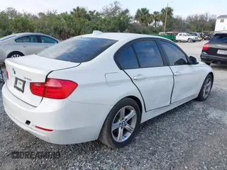 2014 BMW 3 Series 320i with VIN WBA3B1G59ENS78532, listed as a IAAI auction lot 41627172 with 133,049 mi miles. Bid and sale history available at carsss.com. Image 4.