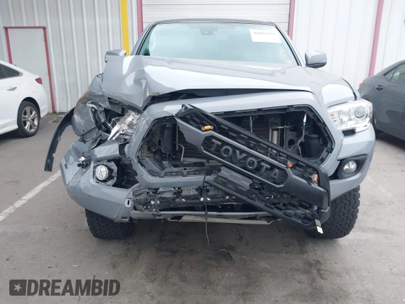 2021 Toyota Tacoma SR z VIN 5TFCZ5AN5MX281428, wystawiony jako IAAI lot #41893437 z przebiegiem 36 204 mil mil oraz . Historia ofert i sprzedaży dostępna na DreamBid. Obrazek 6.