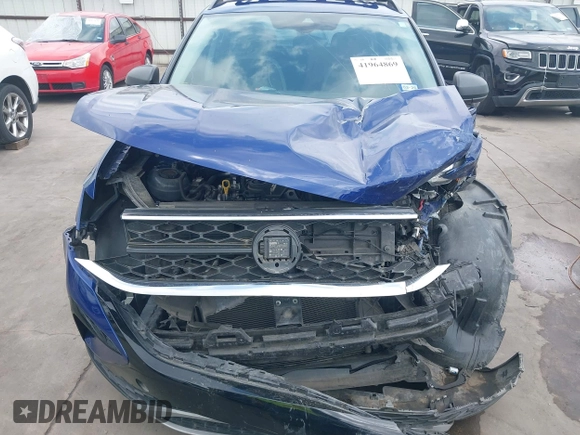 2023 Volkswagen Taos S z VIN 3VVDX7B22PM328971, wystawiony jako IAAI lot #41964869 z przebiegiem 56 683 mil mil oraz . Historia ofert i sprzedaży dostępna na DreamBid. Obrazek 13.
