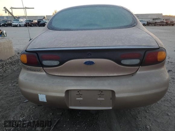 1997 Ford Taurus GL z VIN 1FALP52U9VG142664, wystawiony jako Copart lot #84054224 z przebiegiem 151 610 mil mil oraz Czysty tytuł • Clean title. Historia ofert i sprzedaży dostępna na DreamBid. Obrazek 6.