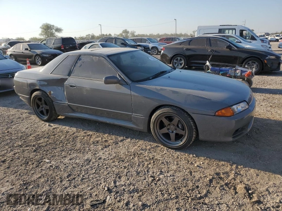 1992 Nissan Skyline z VIN HNR32035831, wystawiony jako Copart lot #74228974 z przebiegiem 49 082 mil mil oraz Szkoda całkowita • Salvage title. Historia ofert i sprzedaży dostępna na DreamBid. Obrazek 1.