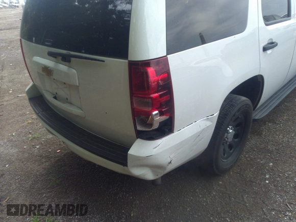 2013 Chevrolet Tahoe Commercial with VIN 1GNLC2E05DR351035, listed as a IAAI auction lot 42641974 with 265,608 mi miles and . Bid and sale history available at DreamBid. Image 6.