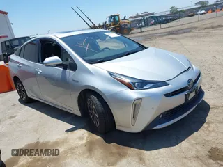 2022 Toyota Prius L Eco z VIN JTDKAMFU5N3188107, wystawiony jako IAAI lot #42223649 z przebiegiem 180 894 mil mil oraz . Historia ofert i sprzedaży dostępna na DreamBid. Obrazek 1.