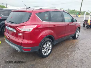 2014 Ford Escape Titanium with VIN 1FMCU0JX3EUD98815, listed as a IAAI auction lot 42078367 with 124,680 mi miles. Bid and sale history available at carsss.com. Image 4.