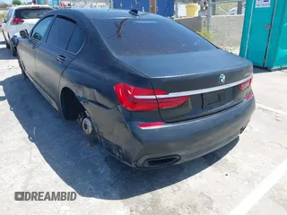 2018 BMW 7 Series 750i with VIN WBA7F0C51JGM23504, listed as a IAAI auction lot 39379378 with 82,251 mi miles. Bid and sale history available at carsss.com. Image 3.