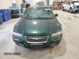 1999 Chrysler Cirrus LXi z VIN 1C3EJ56H6XN600228, wystawiony jako Copart lot #86002314 z przebiegiem 42 402 mil mil oraz Tytuł czysty. Historia ofert i sprzedaży dostępna na DreamBid. Obrazek 5.