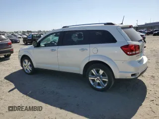 2013 Dodge Journey Crew with VIN 3C4PDCDG5DT668803, listed as a Copart auction lot 61931035 with 121,173 mi miles and Salvage title. Bid and sale history available at DreamBid. Image 2.