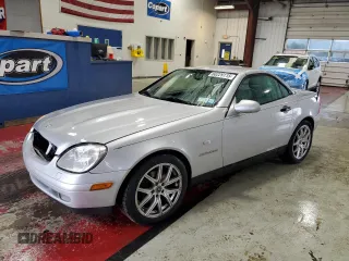1999 Mercedes-Benz SLK 230/320 with VIN WDBKK47F8XF124415, listed as a Copart auction lot 60229115 with 77,410 mi miles and Salvage title. Bid and sale history available at DreamBid. Image 1.