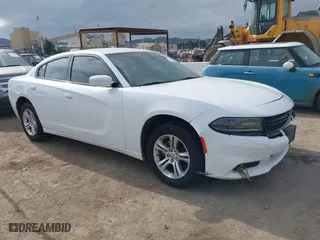2021 Dodge Charger SXT with VIN 2C3CDXBG9MH632361, listed as a IAAI auction lot 41461030 with 58,923 mi miles. Bid and sale history available at carsss.com. Image 1.