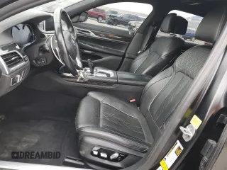 2018 BMW 7 Series 750i with VIN WBA7F0C55JGM23537, listed as a Copart auction lot 76824074 with 64,682 mi miles and Salvage Title. Bid and sale history available at carsss.com. Image 7.