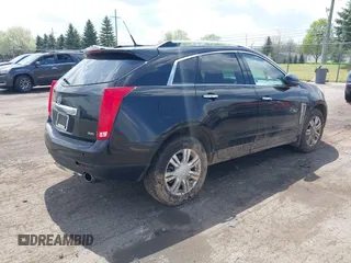 2014 Cadillac SRX Luxury Collection z VIN 3GYFNEE32ES659705, wystawiony jako IAAI lot #42148269 z przebiegiem 140 560 mil mil oraz . Historia ofert i sprzedaży dostępna na DreamBid. Obrazek 4.