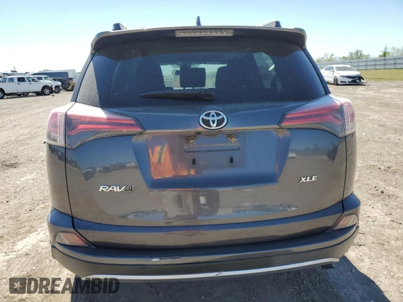2018 Toyota RAV4 XLE with VIN JTMWFREV3JJ729302, listed as a Copart auction lot 49823765 with 100,576 mi miles and Salvage Title. Bid and sale history available at DreamBid. Image 6.