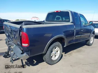 2003 Ford F-150 XL with VIN 1FTRX18WX3NA22323, listed as a IAAI auction lot 41635869 with 129,029 mi miles. Bid and sale history available at carsss.com. Image 4.