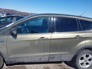 2013 Ford Escape SE with VIN 1FMCU0GX4DUC60741, listed as a IAAI auction lot 41592770 with 121,972 mi miles and . Bid and sale history available at DreamBid. Image 14.